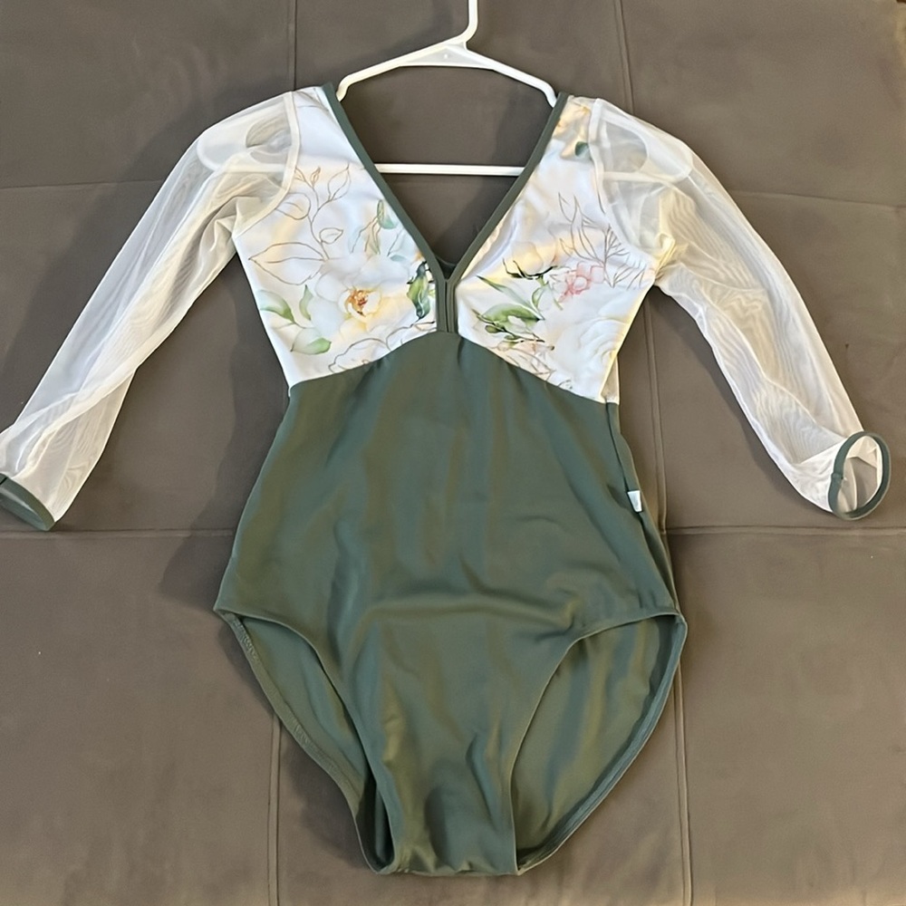 3/4 Sleeve Women’s ballet leotard. White mesh with Green trim and lower bodice.